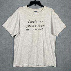 Funny "Careful or you'll end up in my novel" tee.